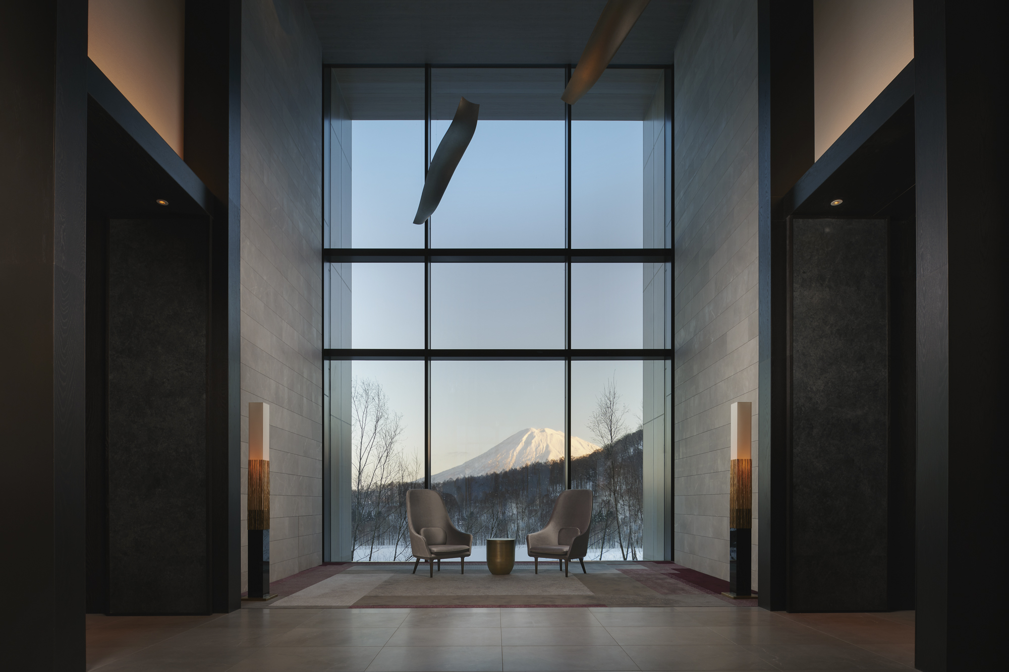 The lobby at Park Hyatt Niseko offers breathtaking views of Mount Yotei on clear days,one of the luxury ski resorts in Japan